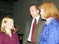  As Employee-of-the-Year finalist Donald (Lee) Currey looks on, Secretary Shari Wilson talks with his daughter, Caroline, 9.