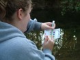 Oakland Mills High School student compares a sample tube