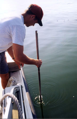 MDE employee sampling water