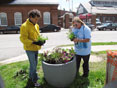 MDE employees planting street corner planters for Earthday 