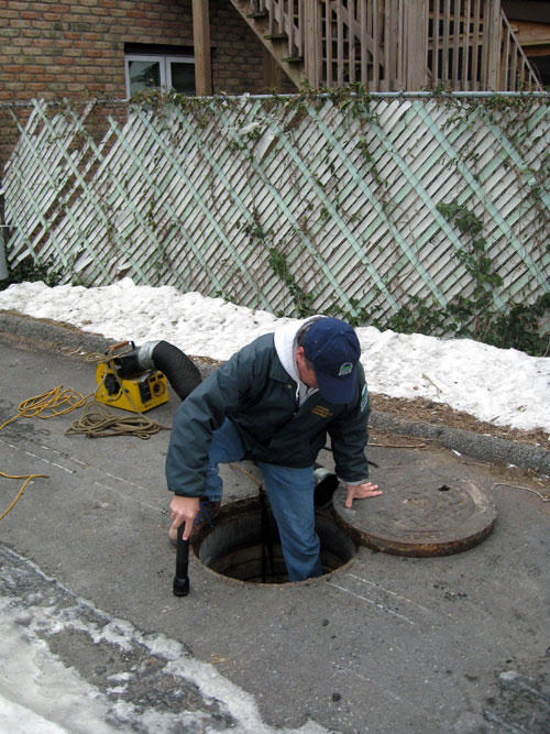 Bill Beatty entering manhole adjacent to Furnace Creek