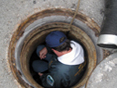 Bill Beatty inspecting end-of-line manhole adjacent to Furnace Creek (and raising the bar of expectation for his field crew!)