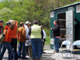 Joe Mills, MDE project leader and tour guide at the Crellin Lime Doser, talks to students and parents.